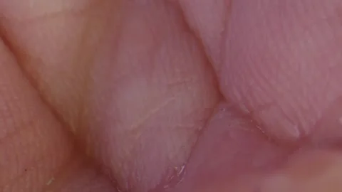 Macro close-up shot of sanitizer falling on hand Stock Footage 131057742