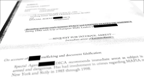 Macro close up shot of top secret redacted paper document with censorship lines Stock Footage 131901655