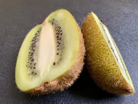 Macro Close Up Sliced Fresh Green Kiwifruit On Dark Background Stock Photos