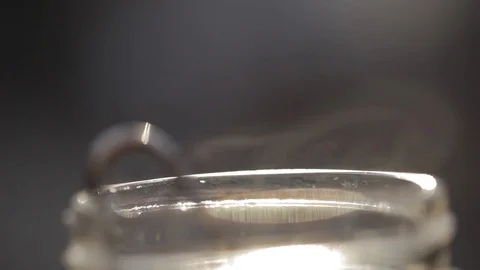 Macro close-up of a smoking hot tea cup Stock Footage