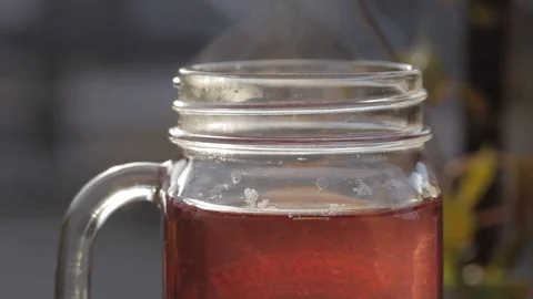 Macro close-up of a smoking hot tea cup Video stock 103148045