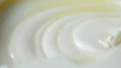 Macro close up of smooth white creamy yogurt texture in plastic container. Stock Footage 333030878