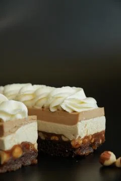 Macro Close-Up of Snickers Style Layered Dessert with Caramel and Nuts Stock Photos