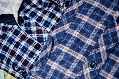 A macro close-up of a soft blue cotton flannel shirt featuring a classic pl.. Stock Photos