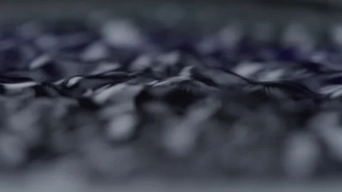 Macro Close up of Sound Waves From Stereo Speaker Vibrating Blue Liquid Stock Footage 208787294