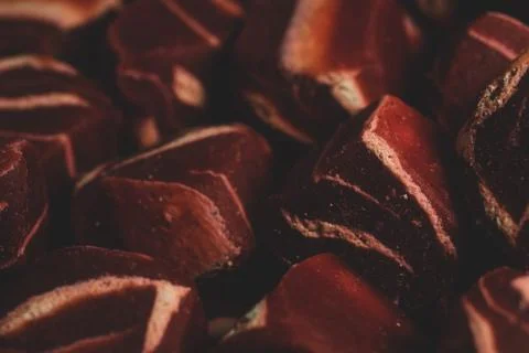 Macro close up of square shaped mini steak Dog treats snack, selective focus Stock Photos