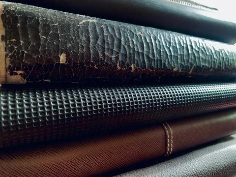 Macro Close Up Stack of Old Vintage Books and Leather Journals Stock Photos