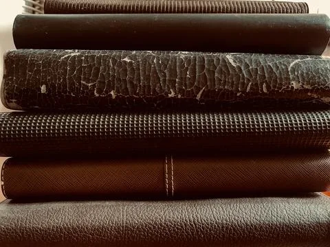 Macro Close Up Stack of Old Vintage Books and Leather Journals Stock Photos
