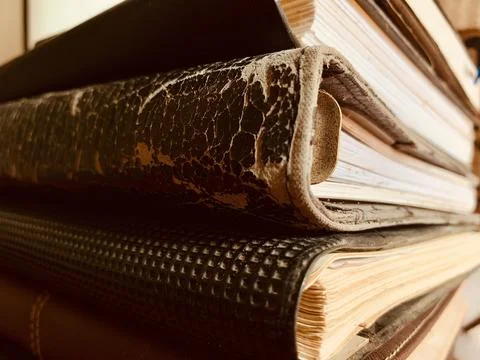 Macro Close Up Stack of Old Vintage Books and Leather Journals Stock Photos