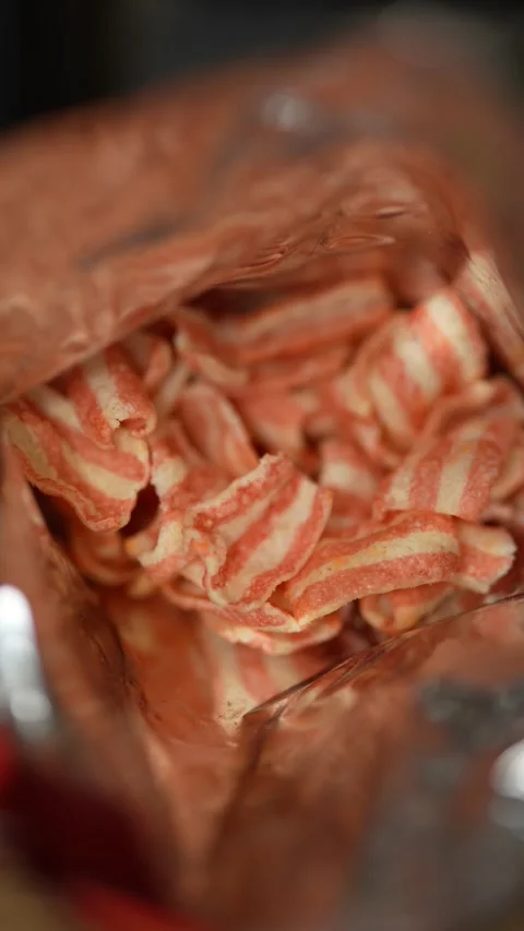 Macro close up of striped potato chips inside snack bag. Stock Footage 331366050