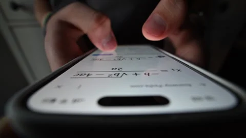 Macro close-up of student's finger tapping phone, studying online. Vídeo Stock 316233440