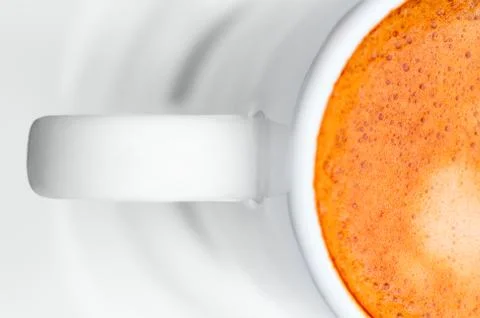 Macro close up studio shot of a half cup of espresso coffee Stock Photos