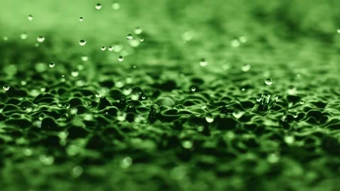 Macro close up super slow motion 1000fps.Splash drops liquid in green color Stock Footage 311005167