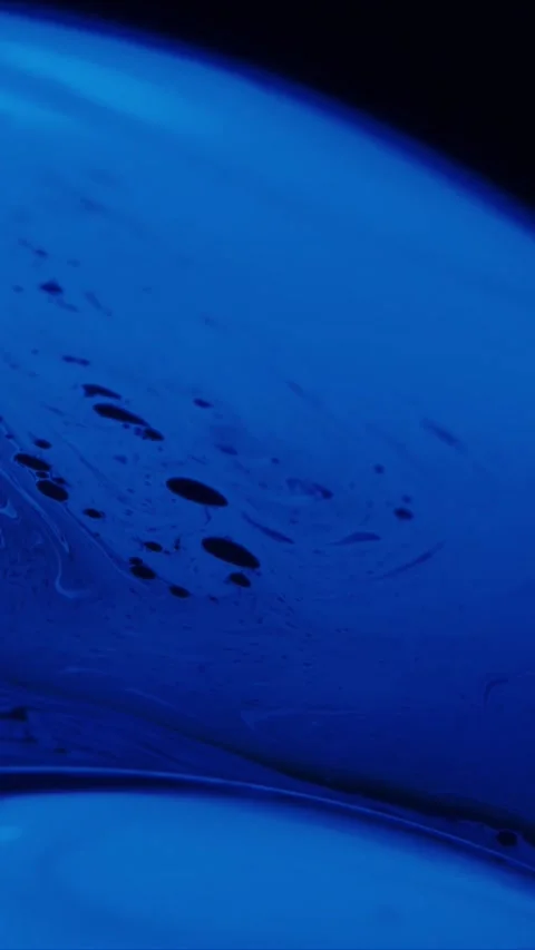 Macro close up of swirling blue soap bubble film surface with iridescent liquid Stock Footage 347692406