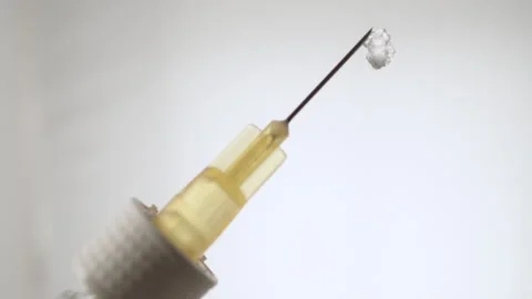 Macro Close-Up of Syringe with Injection Stock Footage 317496966