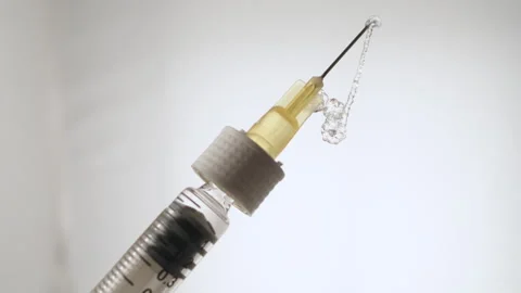 Macro Close-Up of Syringe with Injection Stock Footage 317497048