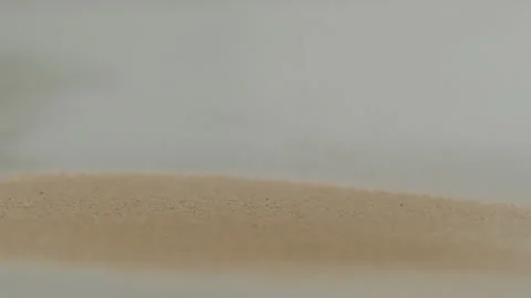 Macro close up tabletop chocolate powder fallin in slow motion Stock Footage 345149497