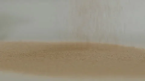 Macro close up tabletop chocolate powder fallin in slow motion Stock Footage 345149576