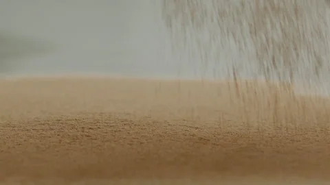 Macro close up tabletop chocolate powder fallin in slow motion Stock Footage 345149633