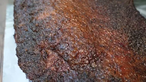Macro Close-up of Texas-Style Smoked Beef Brisket with Savory Dark Bark Stock Footage 338212499