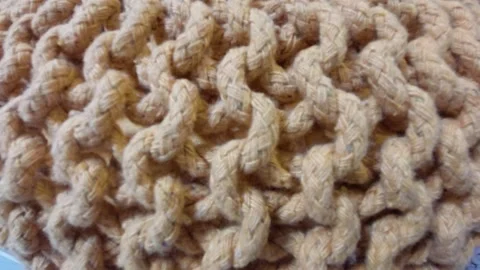 Macro close up texture of beige knitted cotton rope furniture pattern Stock-Footage 346304914