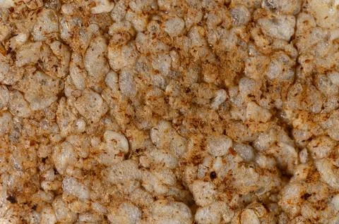 Macro close-up texture of a puffed rice cake with seasoning Stock Photos