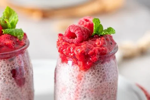 Macro close-up of two raspberry chia puddings Stock Photos