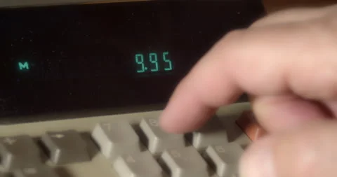 Macro Close ups of hand pushing numeric buttons on vintage Adding Machine Stock Footage 235396791