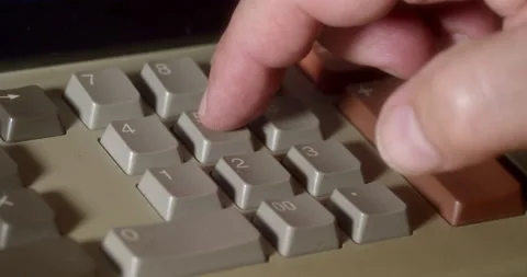 Macro Close ups of hand pushing numeric buttons on vintage Adding Machine Stock Footage 235397754