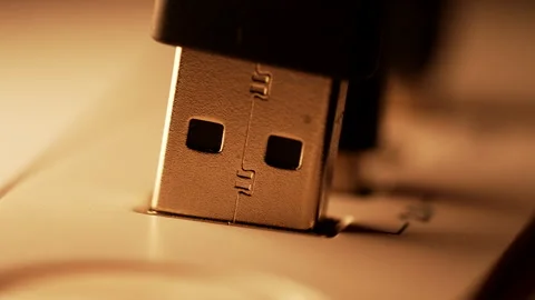 Macro Close-Up of a USB Plug Connecting into a Laptop Port 動画素材 338186812