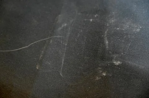 Macro close-up of used dark sandpaper with metallic dust after guitar fretwor Stock Photos