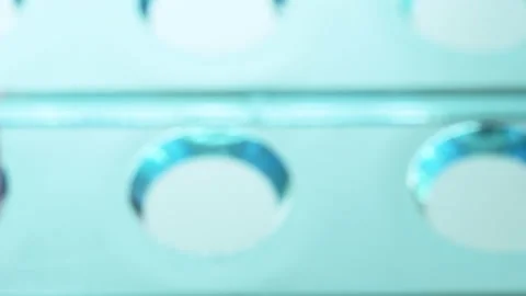 Macro Close up of vaccine sample poured into vial for testing. Biotechnology Видео 130276323