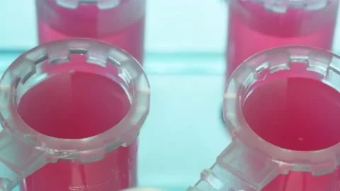 Macro Close up of vaccine sample poured into vial for testing. Biotechnology 스톡 동영상 130277235