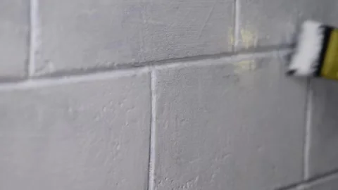 Macro close-up video of a gold and red paintbrush soaked in white paint, st.. 動画素材 278143985