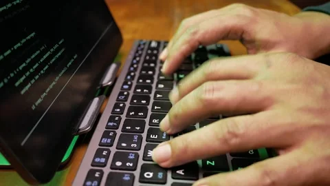 Macro close up view of computer hacker's hands typing code on a keyboard Stock Footage 280178291