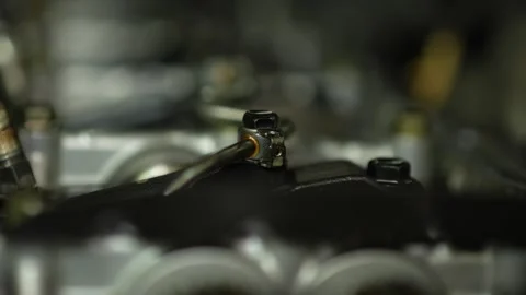 A macro close-up view focuses on a fuel injector nozzle Video stock 345109429