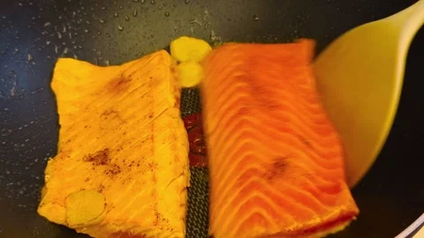 Macro close-up view of fresh hot sizzling fried salmon cooked in a dark fry.. Stock Footage 318254539