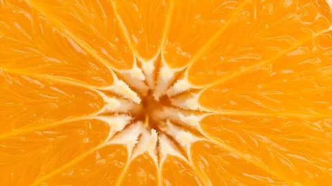 Macro close up view of a fresh orange fruit slice showing the vibrant textu.. Fotos de archivo