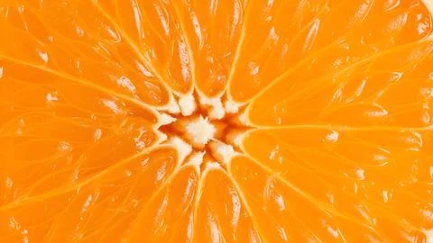 Macro close up view of a fresh orange fruit slice showing vibrant texture a.. Fotos de archivo