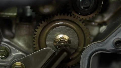 A macro close-up view highlights timing gears with teeth and alignment marks  Stock Footage 345109342