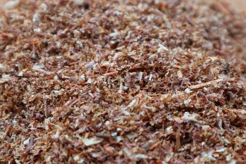 Macro close-up view of a textured pile of mixed brown and white wood shavin.. Stock Photos