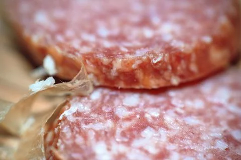 Macro close-up view of thin sliced cured salami sausage with visible fat an.. Stock Photos