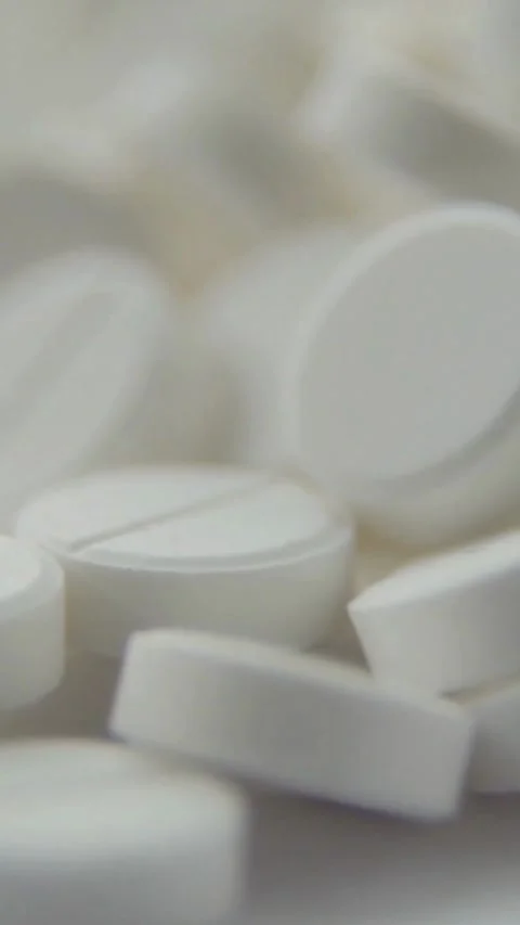 Macro close up view of white round medical pills Stock-Footage 334168567