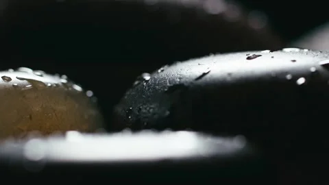 Macro close-up of water droplets on an agate stone Stock Footage 345565302