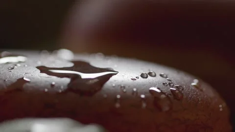 Macro close-up of water droplets on an agate stone. Stock Footage 345565435