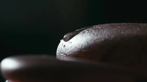 Macro close-up of water droplets on an agate stone. Stock Footage 345566169