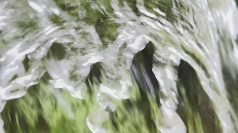 Macro Close-up of Water Droplets Splashing on Green Grass Video stock 335578690