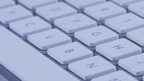 Macro close up of white buttons and space bar on a keyboard Vídeo Stock 70243996