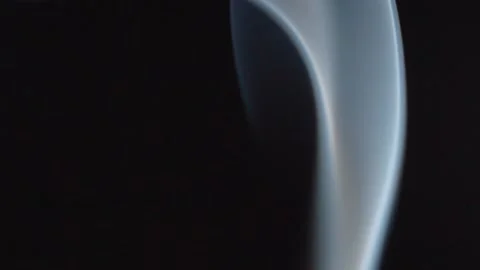 Macro Close Up of White Incense Smoke Swirling Against Black Background Stock Footage 340799883