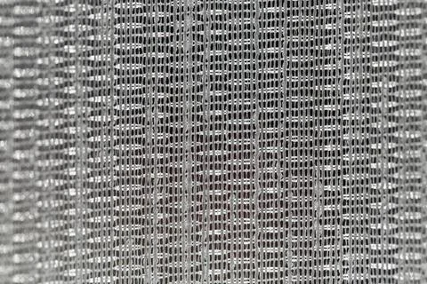 Macro close up of white mesh tulle fabric texture with woven thread pattern Stock Photos
